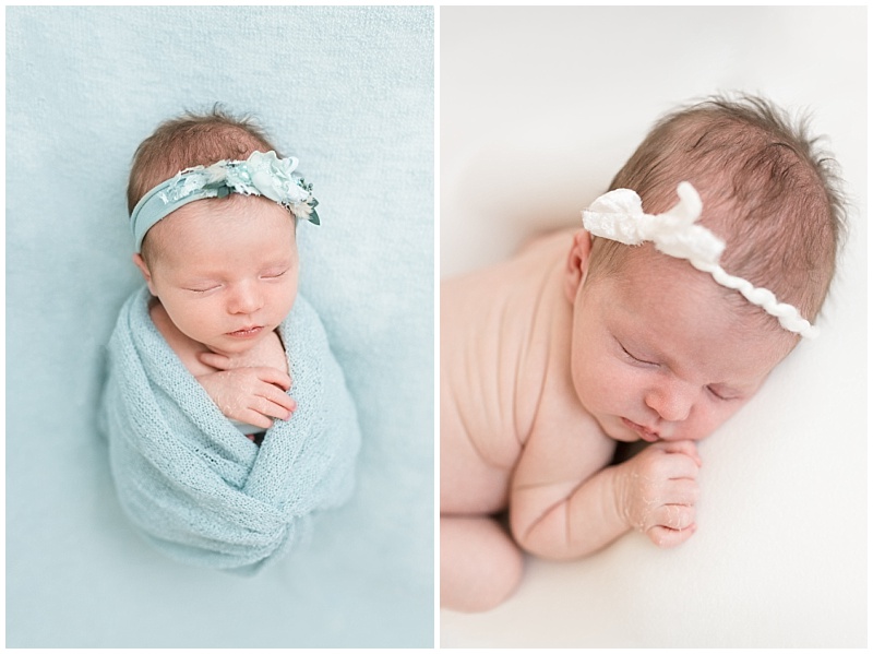 newborn girl in blue wrap and flower headband sleeps